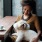 Woman with her dog by a large window in a cafe