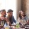 friends sharing a table at a restaurant drinking champagne